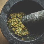 italian basil pesto made in mortar with pestle
