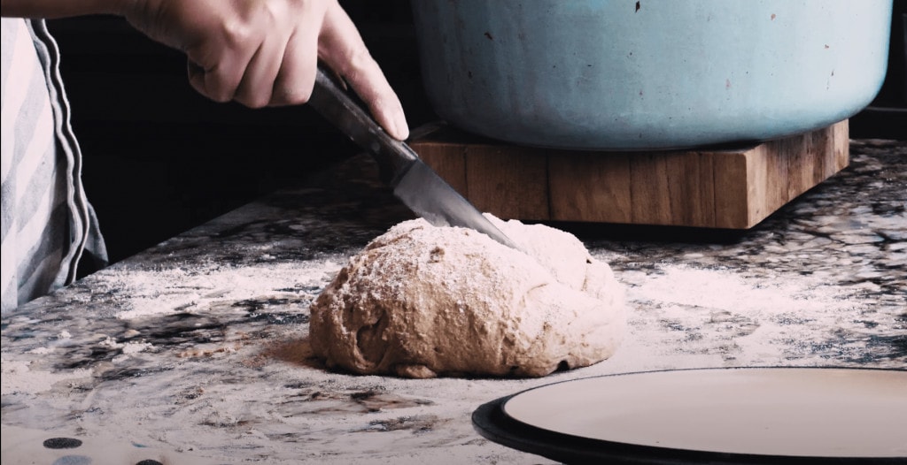 cutting a cross into irish soda bread