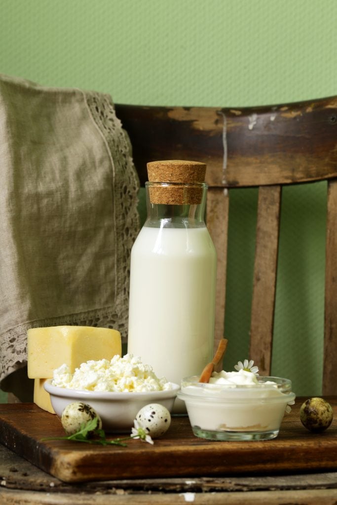milk and cheese on a rustic table