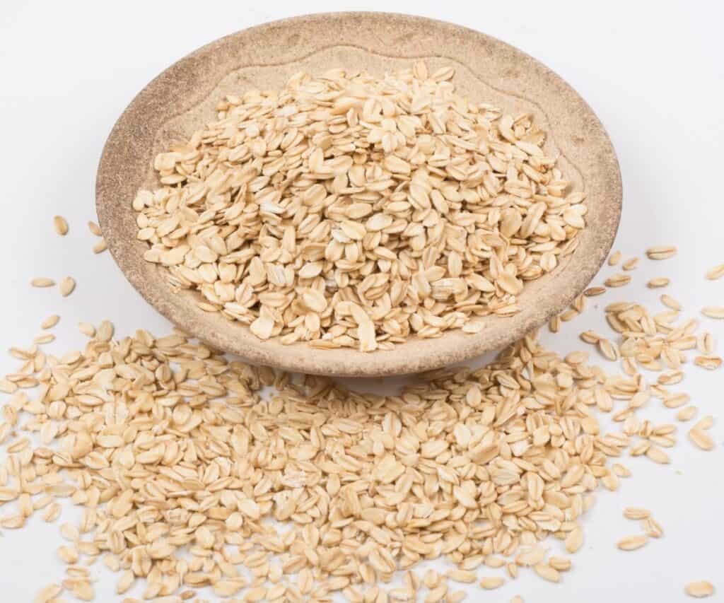 a bowl of sprouted oatmeal on a white background