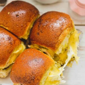 A platter of turkey pesto sliders.