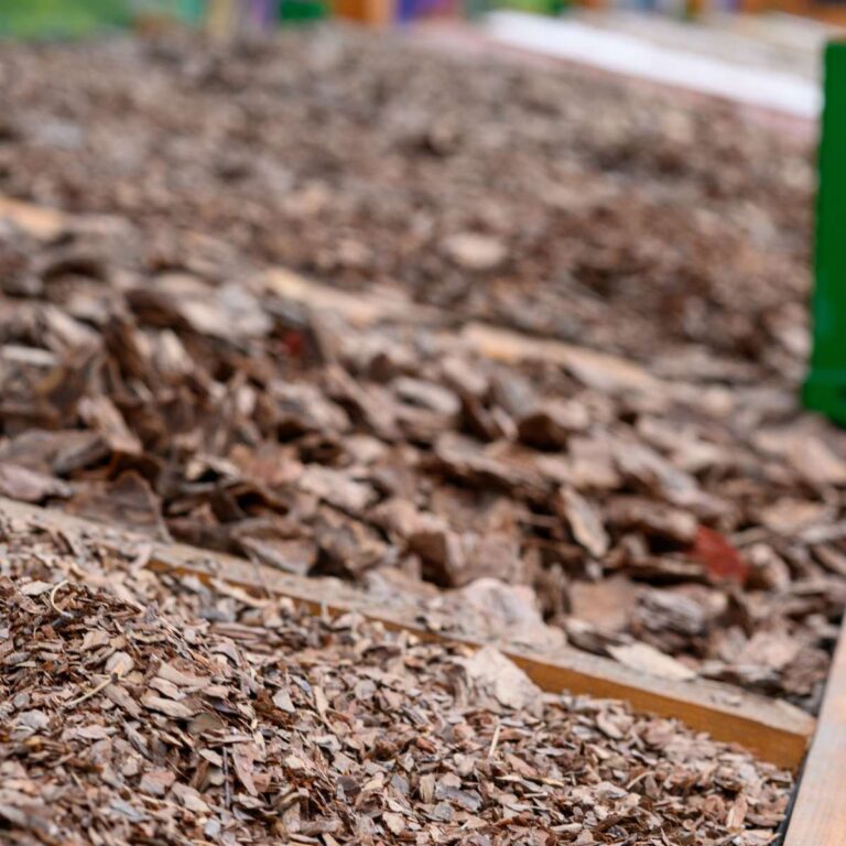 Piles of mulch, wood chips, shavings, and other natural materials that can be used at the bottom of raised garden beds.