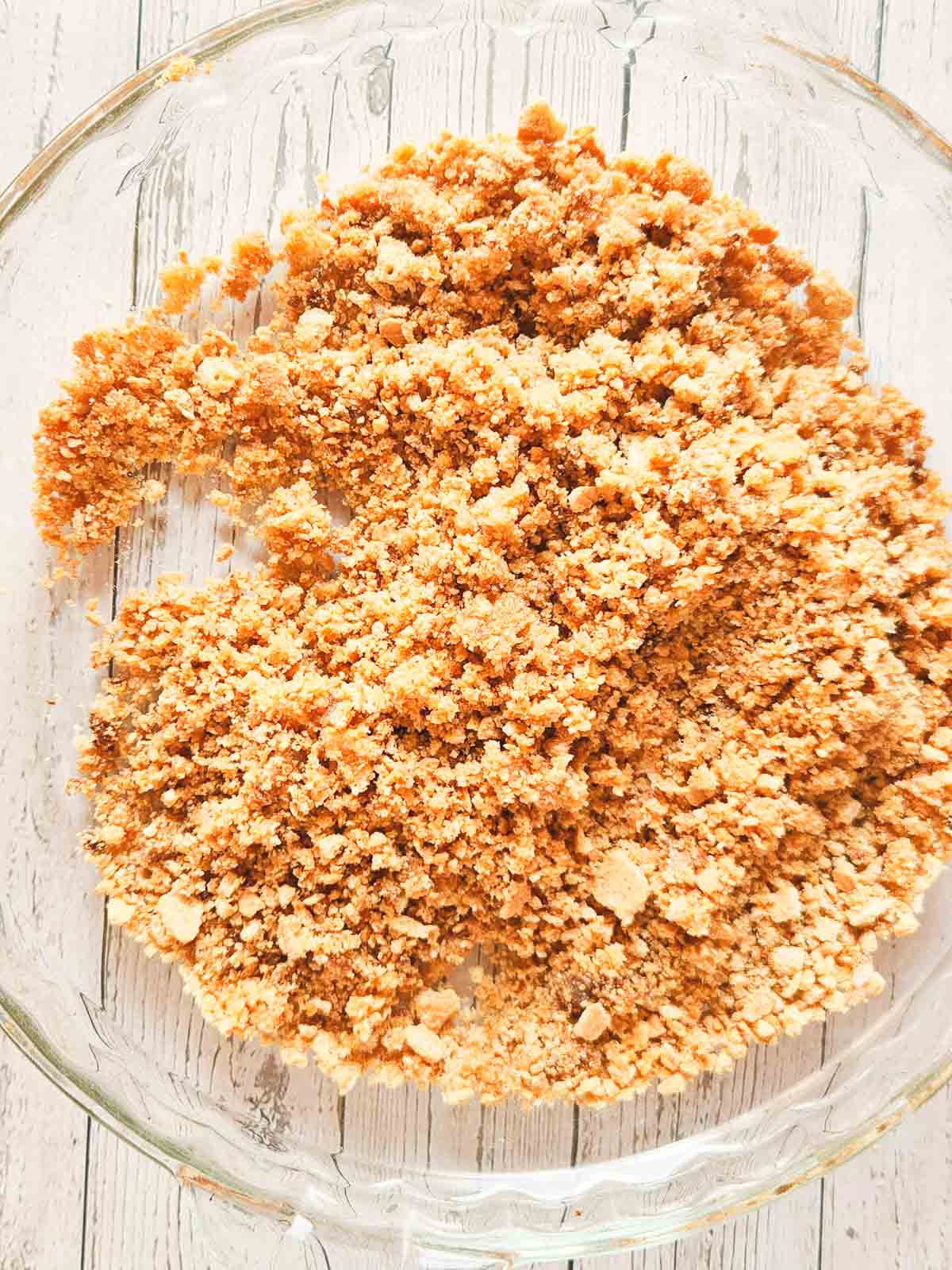 The graham cracker crust no-bake cheesecake ingredients in a bowl after being properly combined.