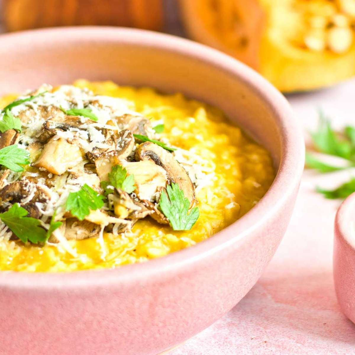 Creamy pumpkin risotto cooked in chicken bone broth. It's topped with mushrooms and extra Parmigiano Reggiano cheese.