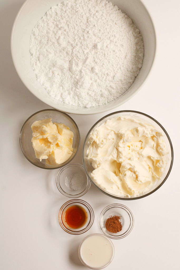 All of the ingredients needed to make the best homemade cream cheese frosting for cakes.