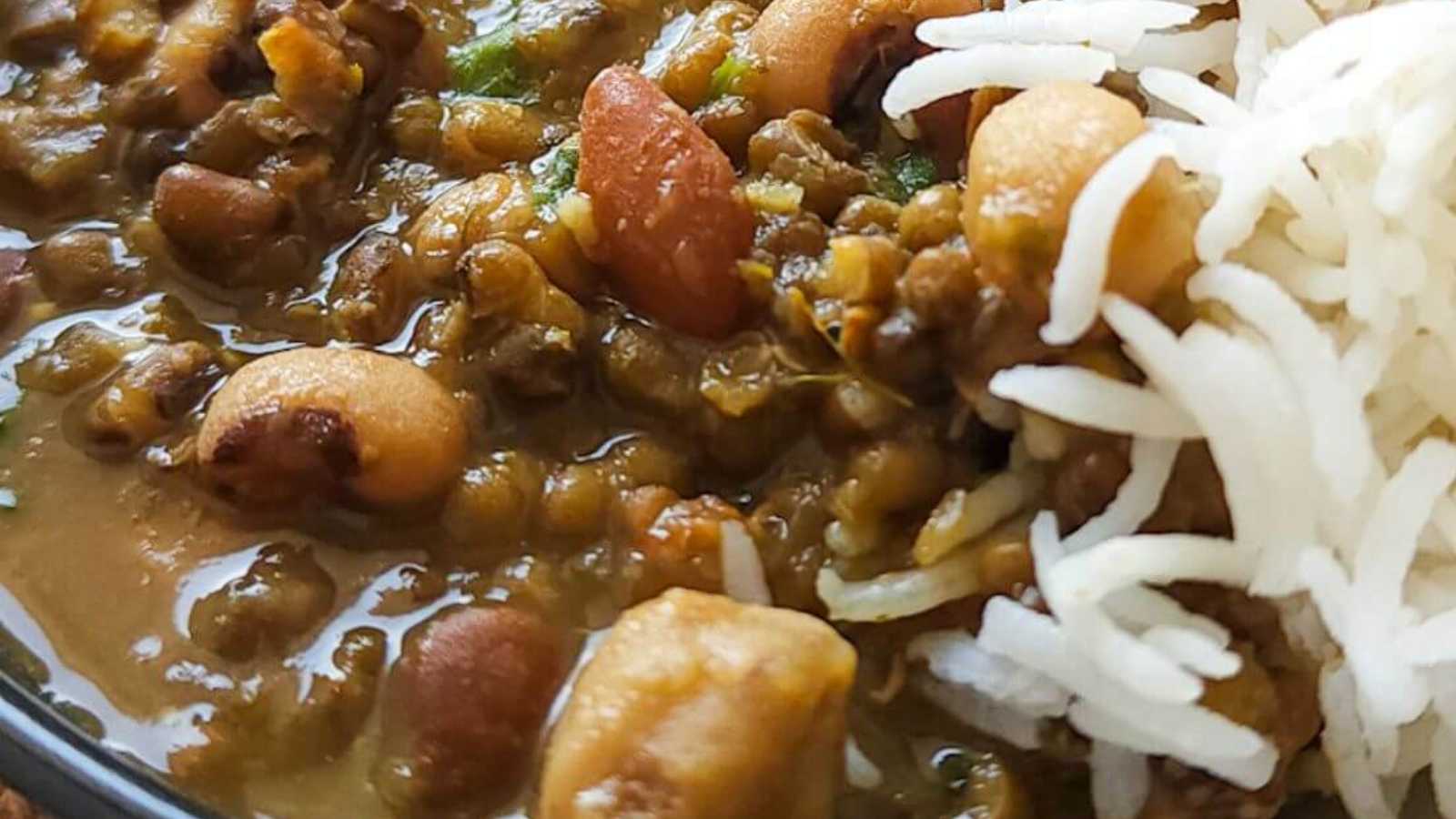 A bowl of mixed beans with rice toppings.