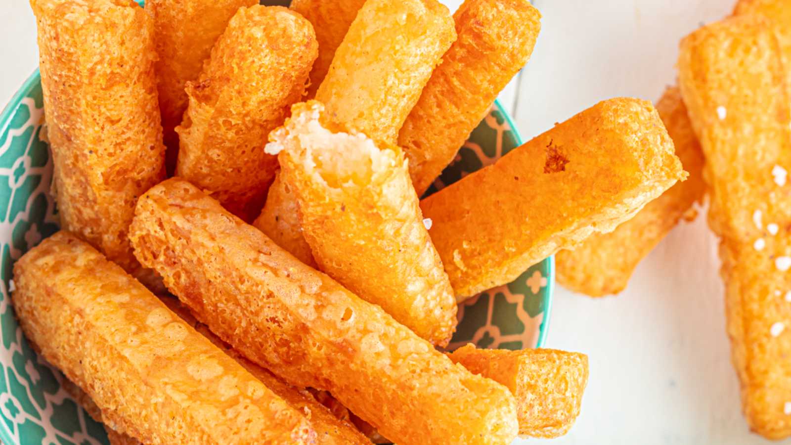 Fry mashed potatoes sticks in a bowl.