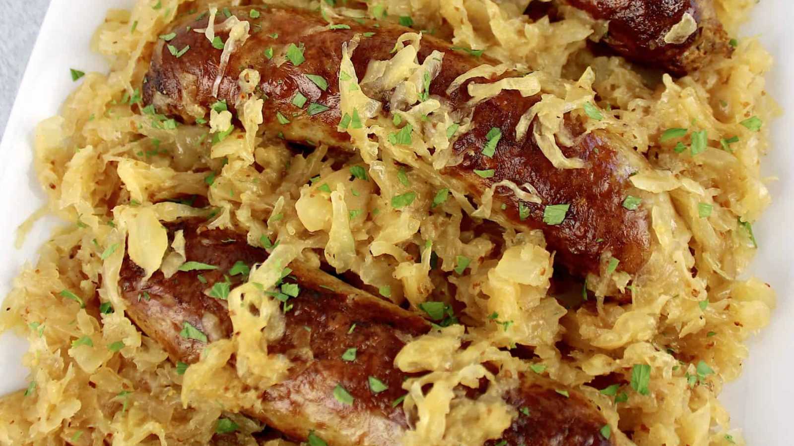A plate of combined smoky flavors of kielbasa with tangy sauerkraut.