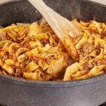A skillet of ground beef and noodles.