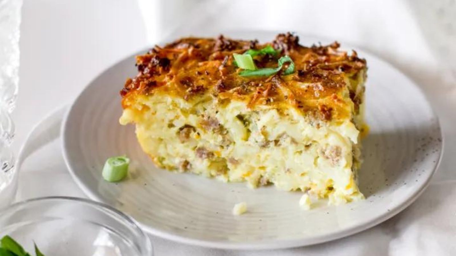 This is a hash brown, cheese, egg and milk casserole with venison breakfast sausage.