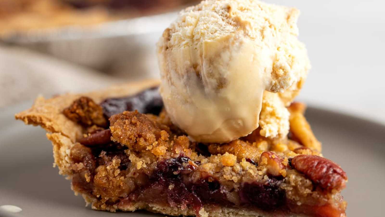 A rustic apple blueberry pie is made with frozen blueberries and a pre-made pie crust.