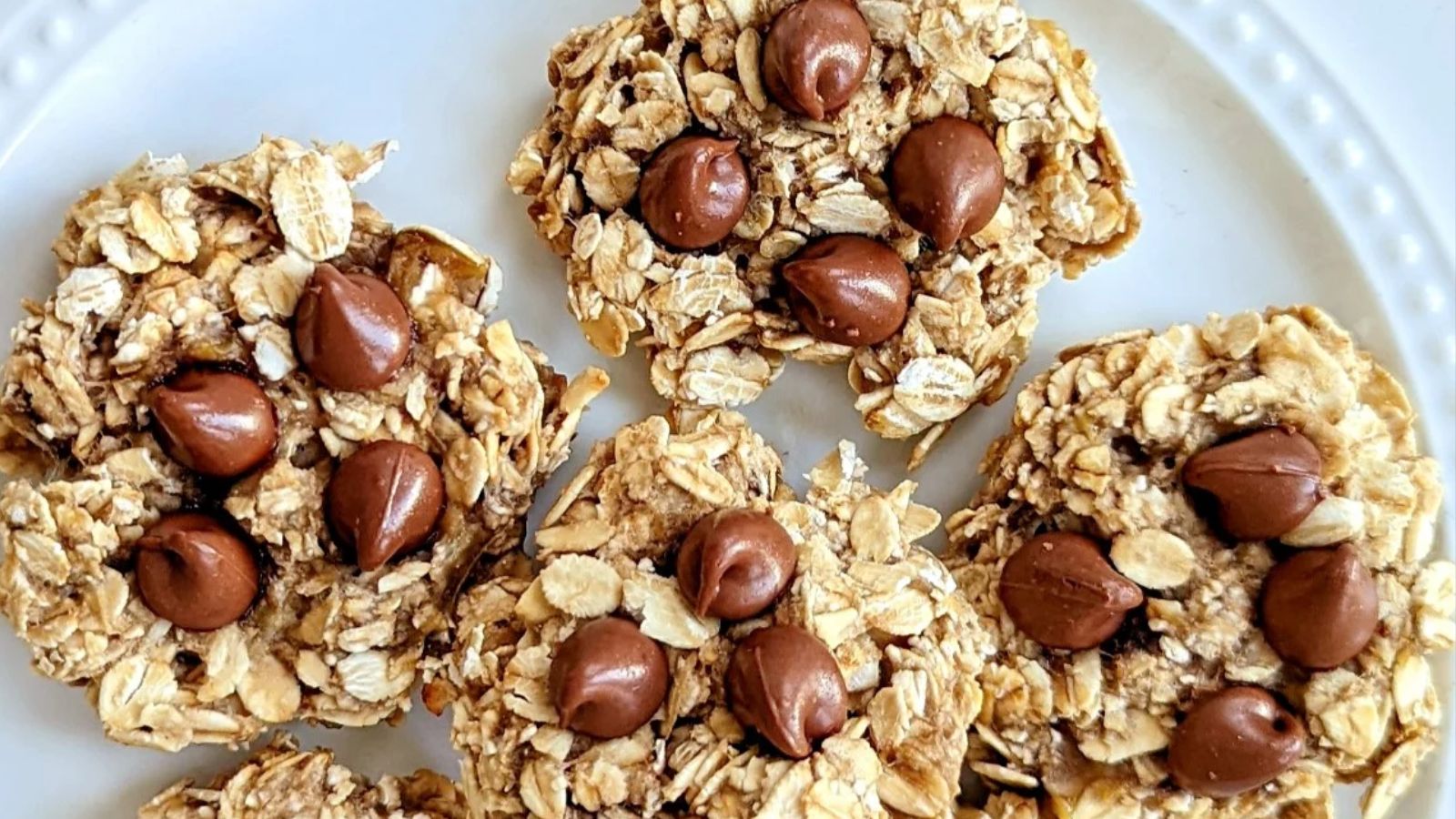 Round banana oat chocolate cookies on a plate.