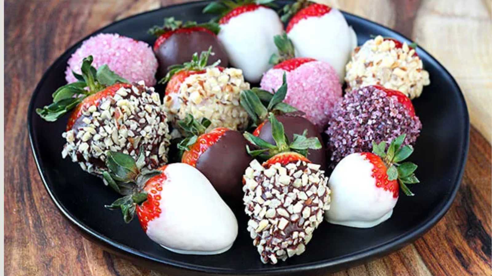 A plate of strawberries coated with different flavors.