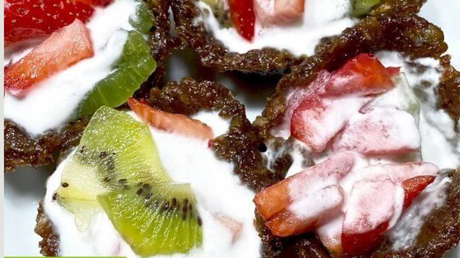 Mini strawberry tarts with coconut cream with fruits topping.