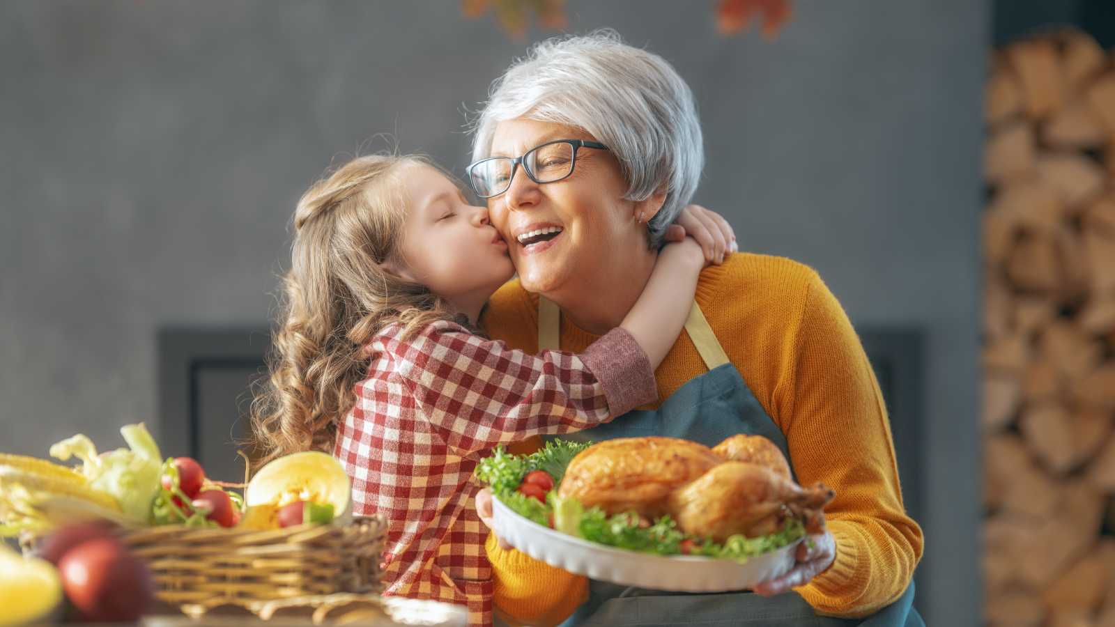 Loving family bonds: A tender moment between a grandmother and granddaughter, as the grandma lovingly kisses her cheek.