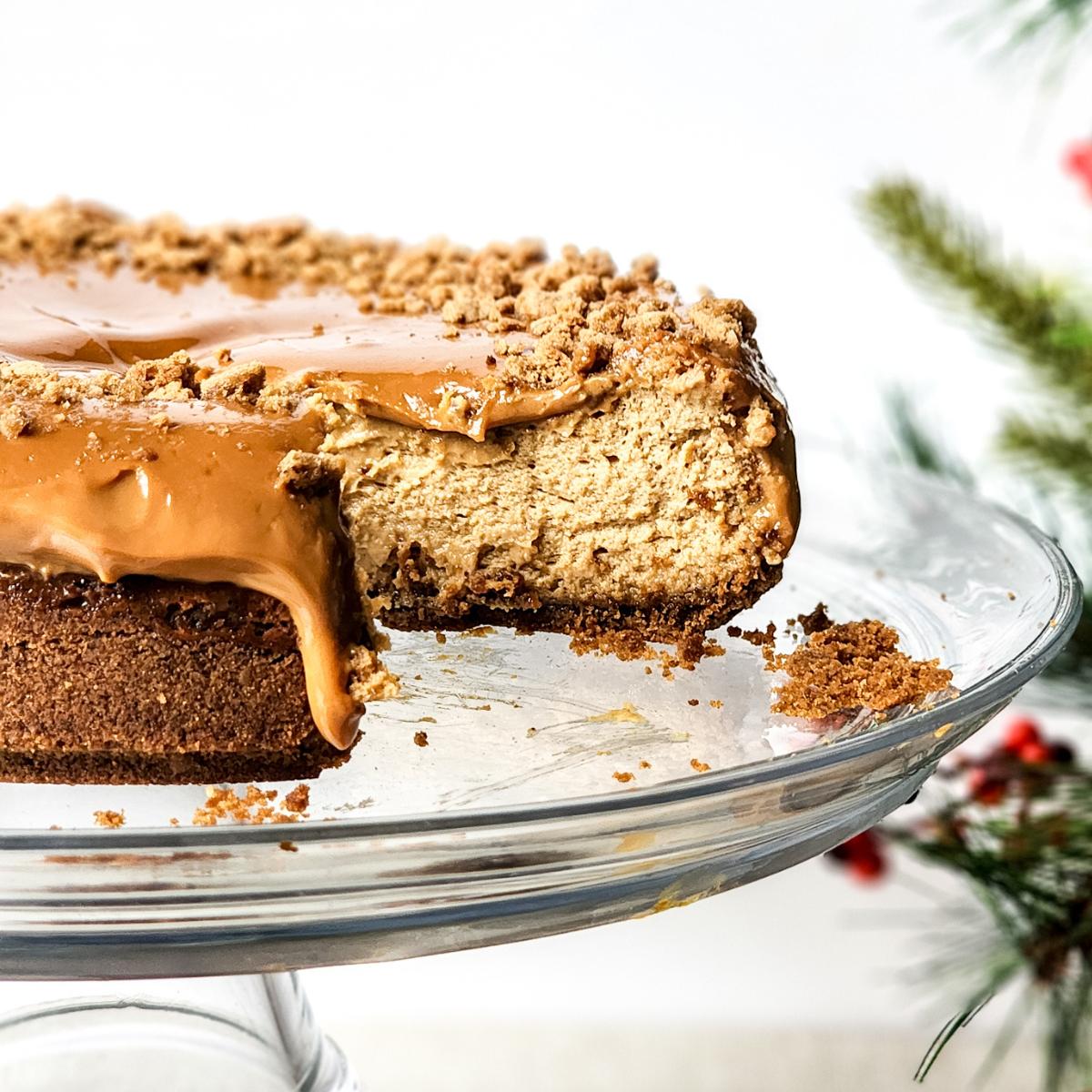 A slice of homemade gingerbread cheesecake on a white plate.