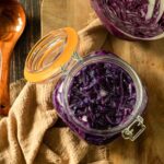 Red cabbage sauerkraut in mason jar.