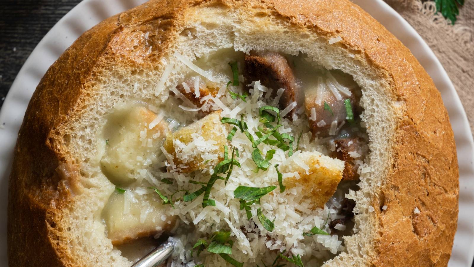 The finished garlic soup served in a bread bowl.