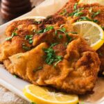 German schnitzel served on a plate.