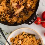 A pot and bowl full of creamy marry me chicken orzo pasta with spinach and sundried tomatoes.