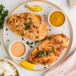 A chicken breast coated in a crispy panko breadcrumb coating that is golden brown.