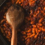 A heavy cast iron pot full of prebranac or Serbian baked beans.