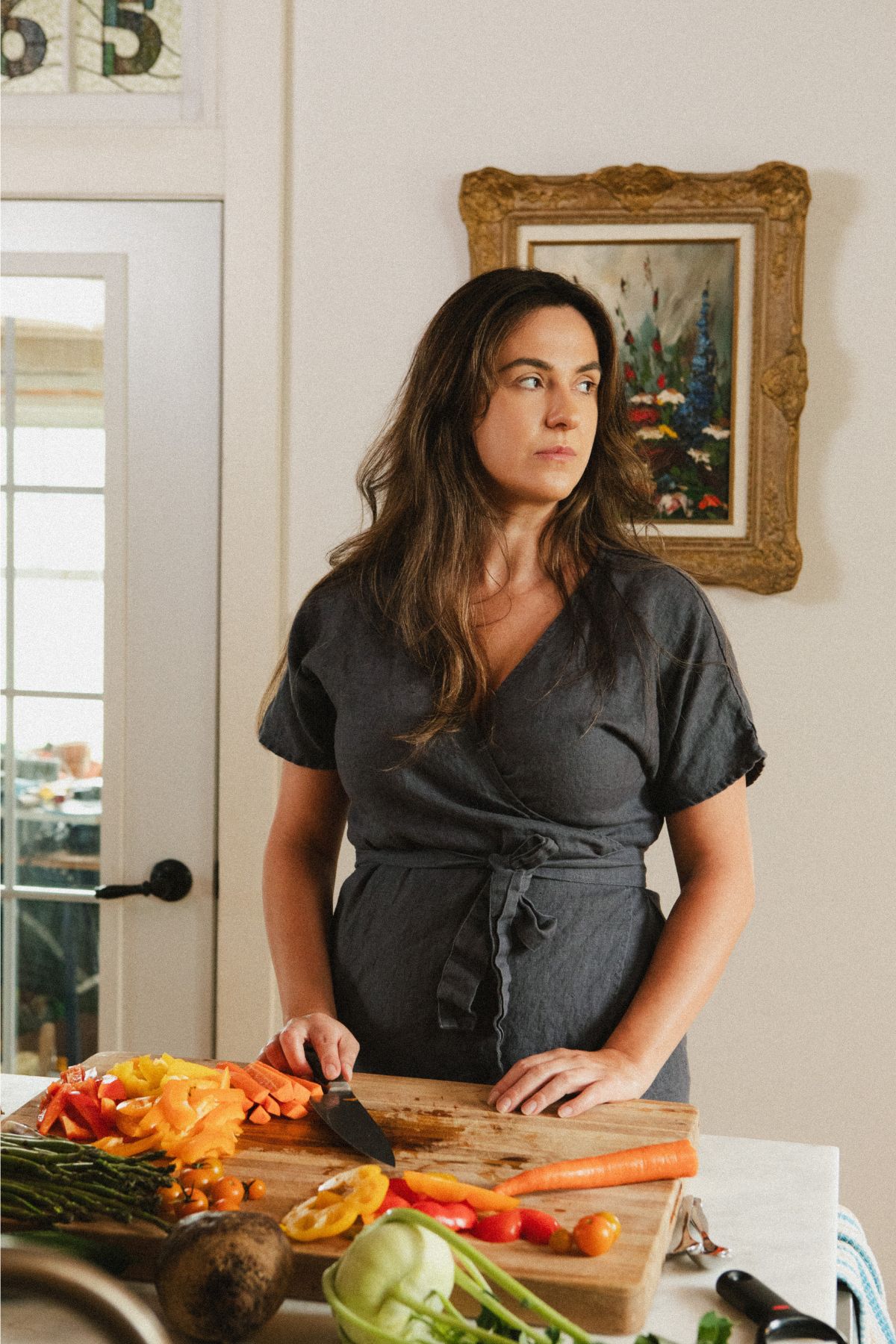 A photo of Jana Dziak, founder of The Peasant's Daughter and Heritage Kitchen Revival standing in her kitchen.