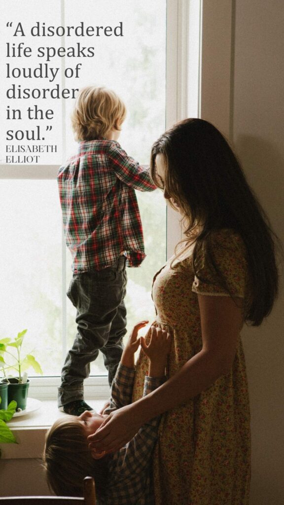 A woman with her two sons at the window.