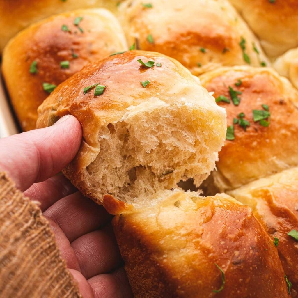 Sourdough slider buns baked in a tray.