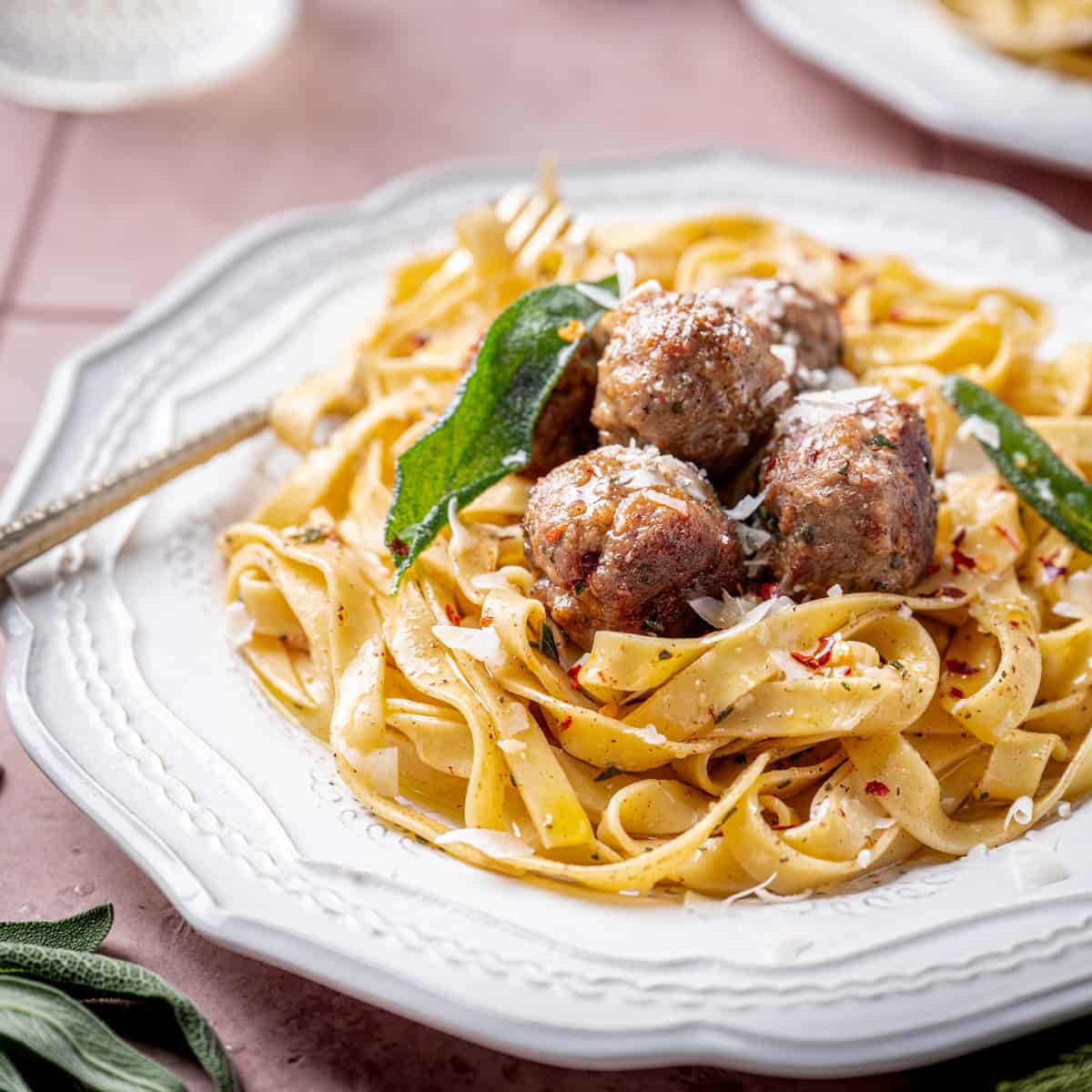 Meatballs in sauce served on top of egg noodles.