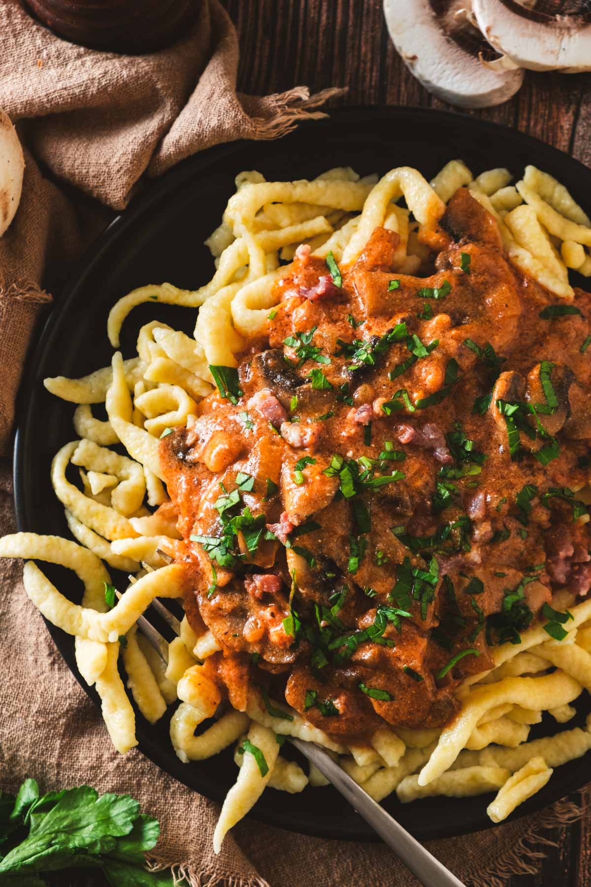 Bowl of homemade spaetzle served with rich hunter's sauce